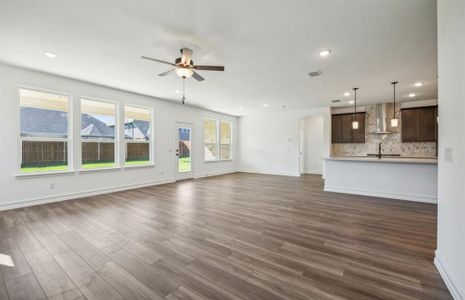 Airy gathering room with expansive windows  *real home pictured