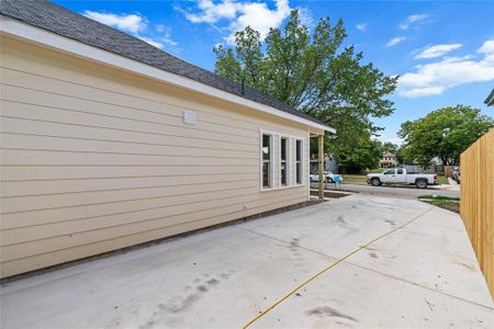 View of side of home featuring a patio area