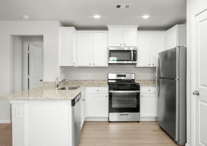 The chef-ready kitchen has stainless steel appliances!