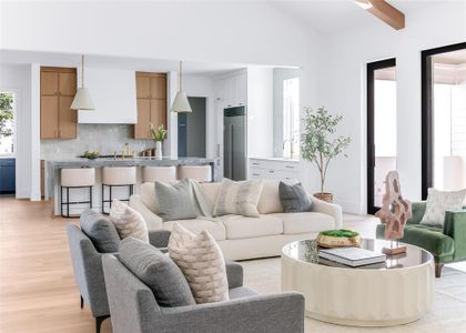 Living room featuring light hardwood / wood-style flooring and lofted ceiling