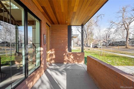 Generous front porch sets the stage for a welcoming entry