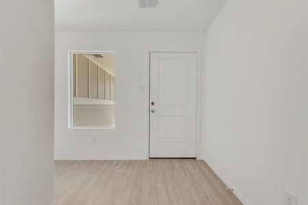 Spare room with light hardwood / wood-style flooring