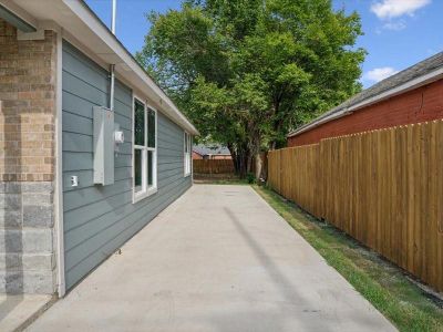 View of side of home featuring a patio area