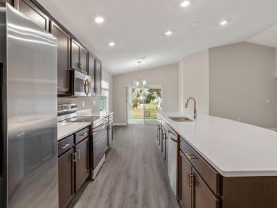 This beautiful, open-layout home includes luxury vinyl plank flooring, quartz countertops, and 36-inch birch wood cabinets.