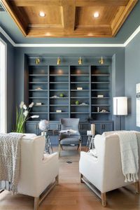 Natural light filled office with custom wood enhanced ceiling feature.