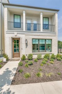 View of front of home featuring a balcony