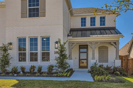 View of front of property featuring a porch and a front lawn