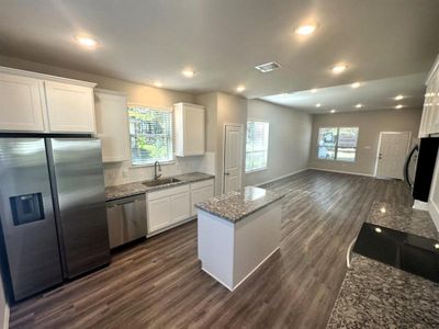 Stainless Steel Appliances, granite counters, ceramic tile backsplash & 42" upper cabinets!