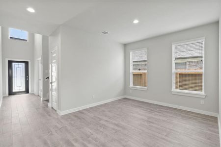 Make memories gathered around the table with your family and friends! This dining spacious room features elegant flooring custom paint, and immediately adjacent to kitchen for open concept feel. Sample photo of completed home. As-built color and selections may vary.