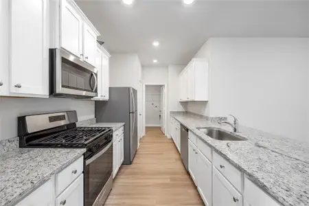 This chef-ready kitchen has plenty of counterspace and Whirlpool kitchen appliances, perfect for cooking a delicious meal.