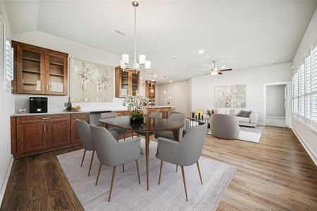 The dining room accommodates large furniture and features a built-in buffet, as shown in this virtually staged photo.