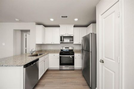 Kitchen with upgraded Whirlpool kitchen appliances.