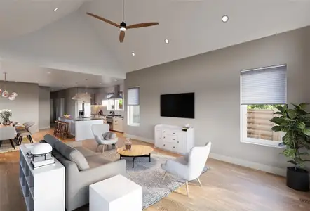 Living room with high vaulted ceiling, wood flooring, and a healthy amount of sunlight.