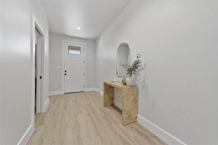 Entryway with light hardwood / wood-style floors