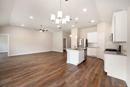 Open concept living space/ kitchen /dining area.