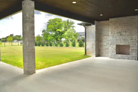 View of patio with fireplace