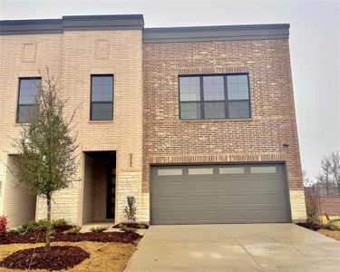 View of front facade featuring a garage