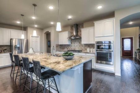 Photo of Pulte model home with same floor plan, not of actual home listed.