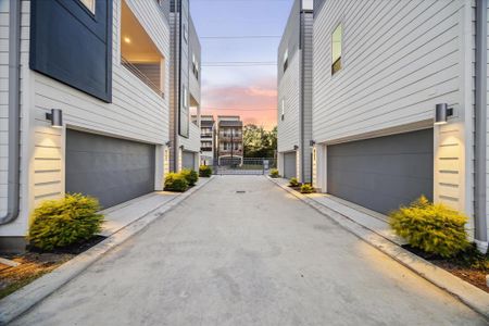 Contemporary single-family homes with sleek, modern architecture featuring clean lines and a two-tone façade. These homes boast spacious open balconies, large windows for ample natural light, and private gated entry.