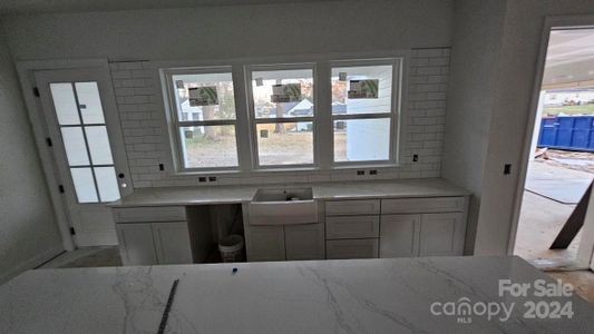 Back wall of kitchen overlooking porch