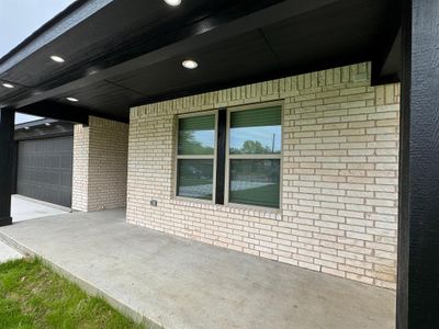 View of patio / terrace featuring a garage