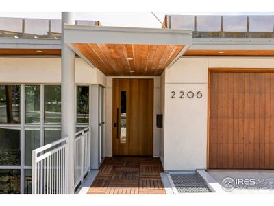 A gorgeous natural limestone tile and stucco facade with steel accents and a standing seam steel roof add spectacular curb appeal.