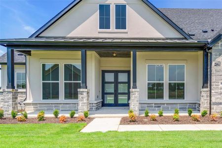 View of front of house with a front lawn and a porch