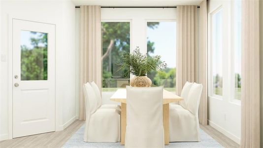 Dining area with light wood-type flooring