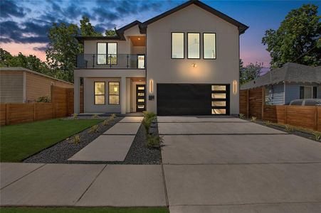 Modern home with a balcony and a garage