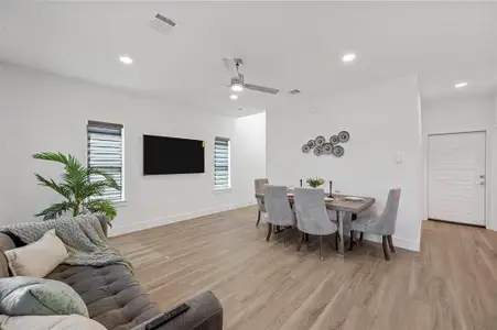 Dining room featuring baseboards, visible vents, and light wood-style floors