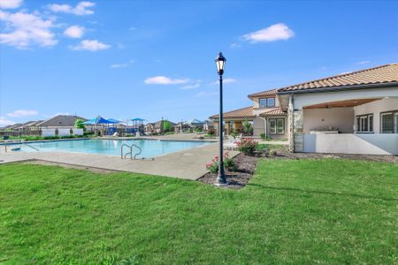 View of pool featuring a patio area, fence, a fenced in pool, and a yard