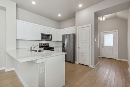 Kitchen in the Birch home plan by Trophy Signature Homes – REPRESENTATIVE PHOTO