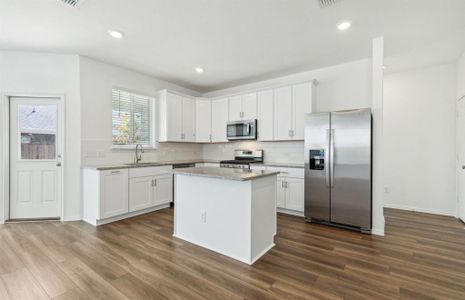 Bright kitchen with ample cabinet space *real home pictured