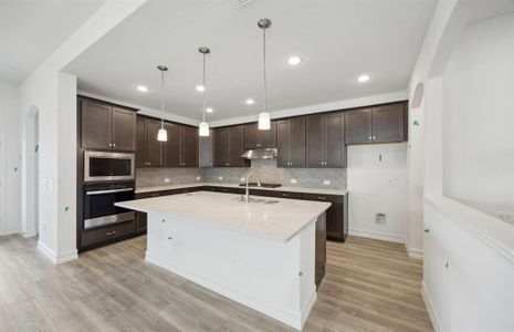 Airy kitchen with ample cabinet space *real home pictured