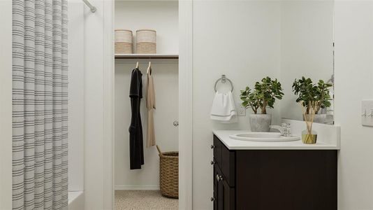 Bathroom with shower / bathtub combination with curtain and vanity