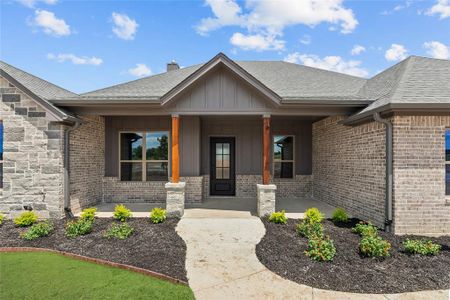 Doorway to property with covered porch