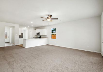 The open layout of this home has the family room open to the kitchen.