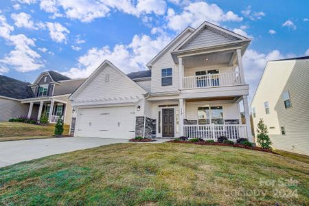 Homesite 63 features a Cypress H floorplan with front-load garage and balcony.