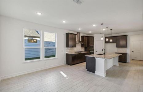 Spacious kitchen with ample windows *real home pictured