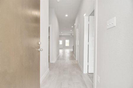 Grand entrance with tile floors, glass door (to be installed), and oversized base boards. Actual as-built colors and selections may vary.