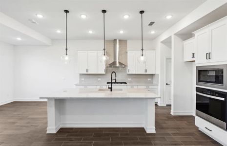 Spacious kitchen with oversized island *real home pictured