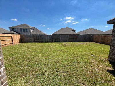 The backyard includes sod and built in sprinkler system