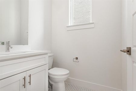 Bathroom with vanity and toilet