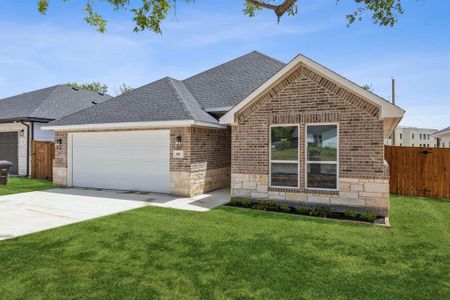 View of front of house with a garage and a front lawn