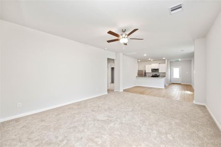 Spacious living room, open to the kitchen and dining area.