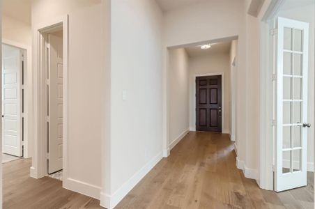 Hall featuring light wood-type flooring