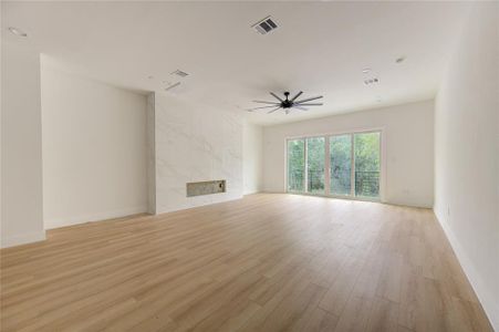 Large living room with Juliet balcony and lots of natural light.