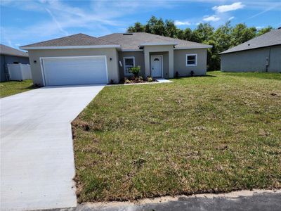 New construction Single-Family house 502 St Johns Court, Poinciana, FL 34759 - photo 0