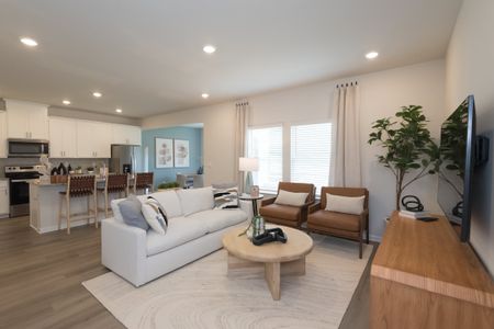 The kitchen overlooks into the living room and dining room in this homes open-concept floorplan.