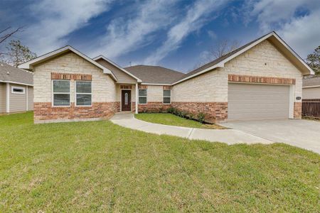 Charming brick facade adds timeless appeal and durability, enhancing the home's curb appeal and overall character.